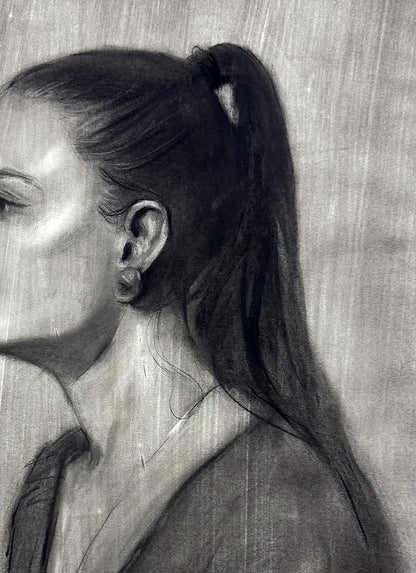 Charcoal portrait sketch of Persephone Annam Butt profile view