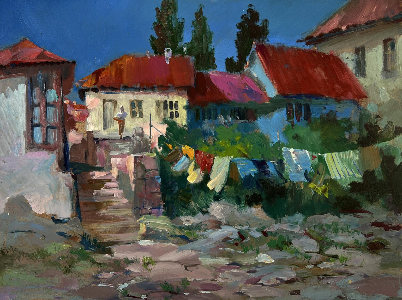 Oil painting of vibrant red-tiled village roofs by Yuriy Suprunchuk
