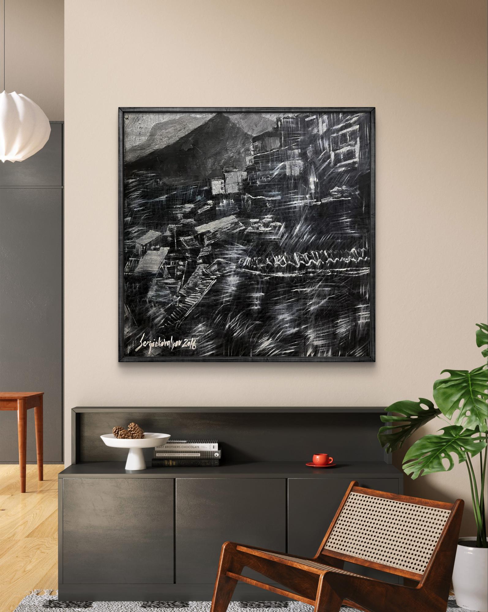Black-framed charcoal sketch of Serhiy Kovalev City Twilight on wall