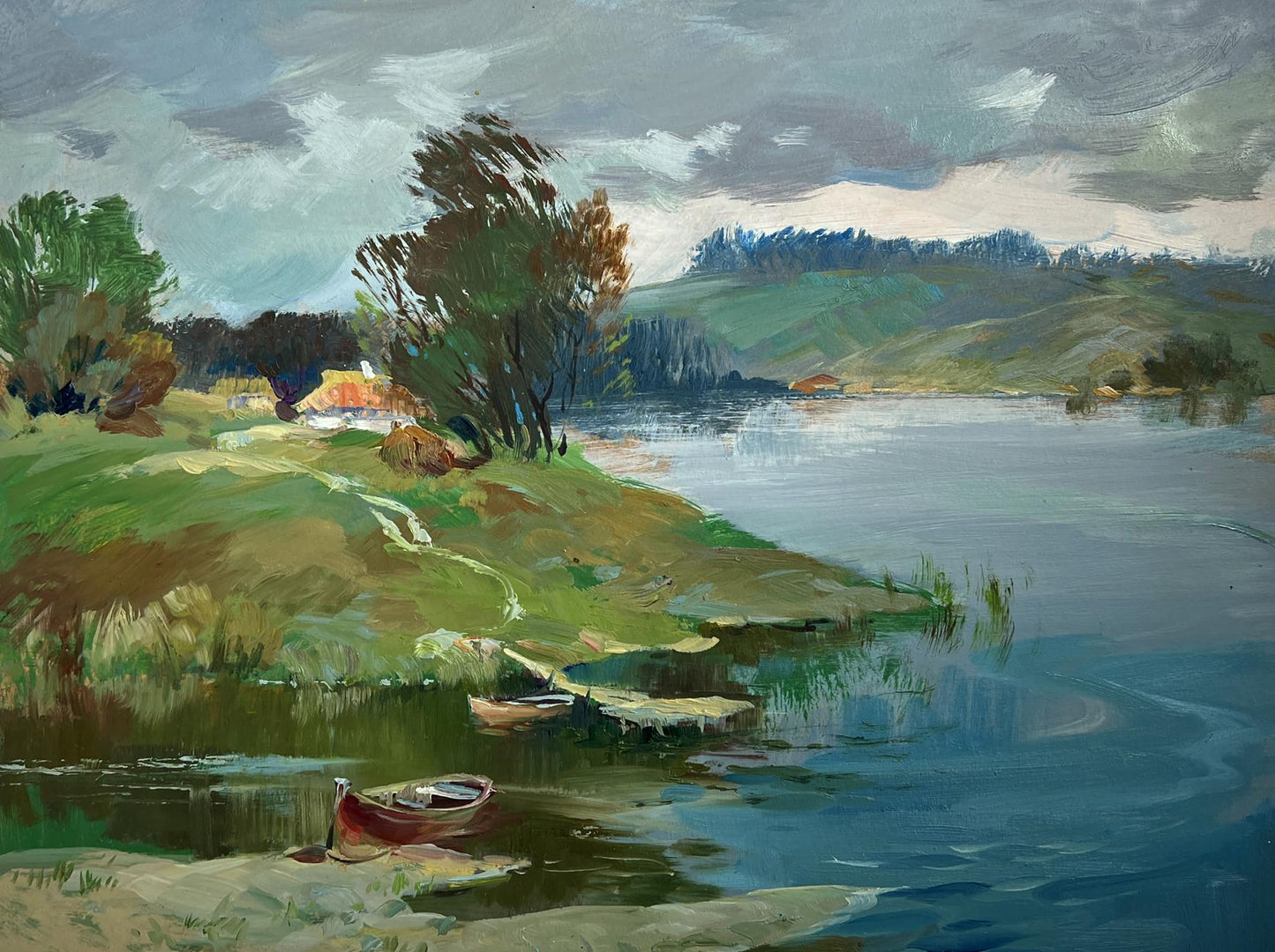 Oil painting of small red rowboat on sandy shore of river near village by Yuriy Suprunchuk