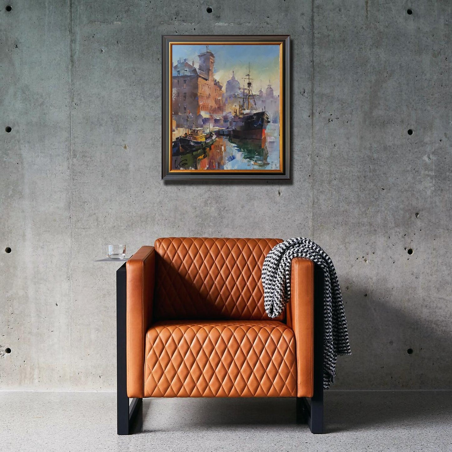 Tan leather diamond-quilted armchair with black metal legs by Volodymyr Gluhomanyuk