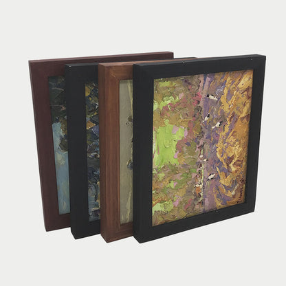 Square abstract paintings in textured vibrant colors in custom wooden frames