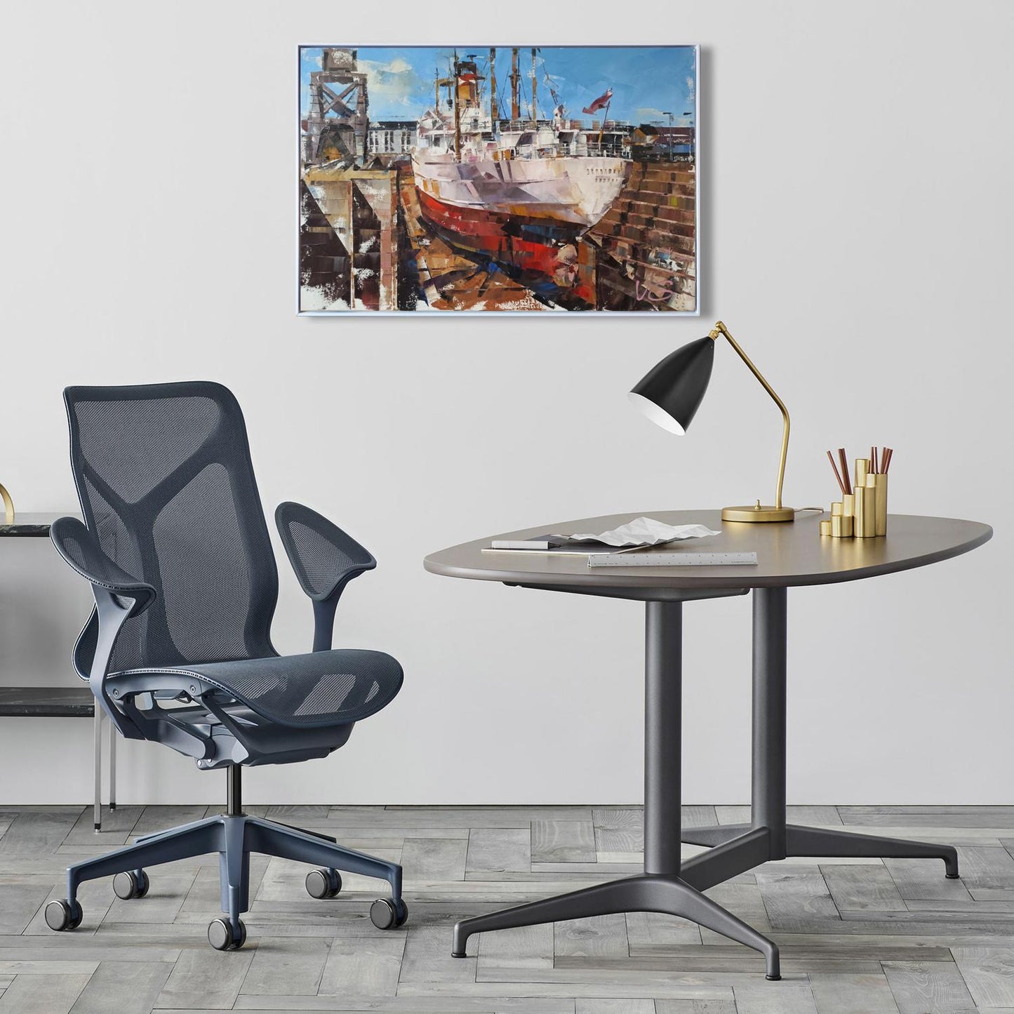 Dark gray mesh ergonomic office chair with adjustable armrests