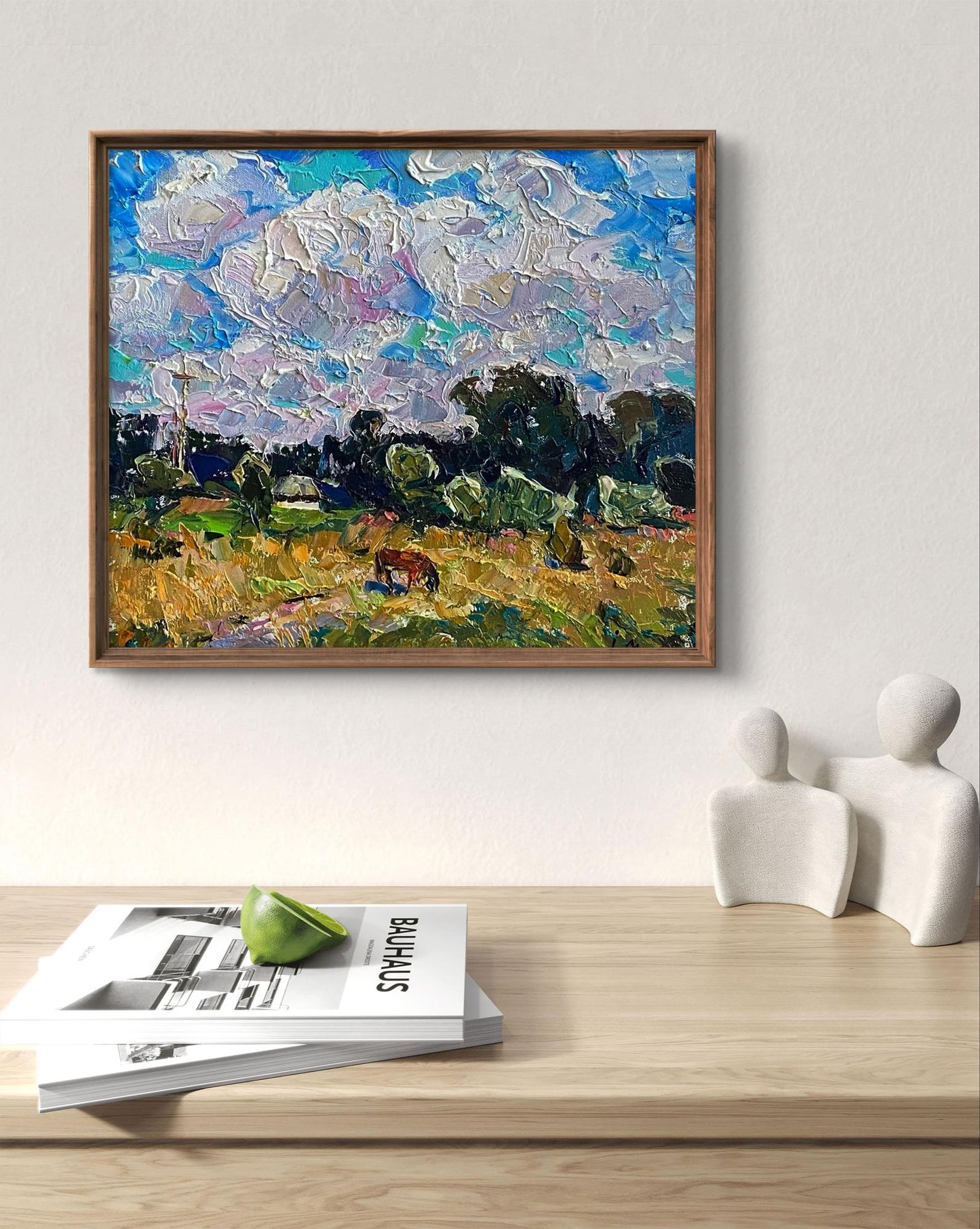 Framed impressionist oil painting by Oleksiy Ivanyuk of horse grazing in golden field