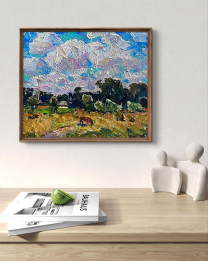 Framed impressionist oil painting by Oleksiy Ivanyuk of horse grazing in golden field