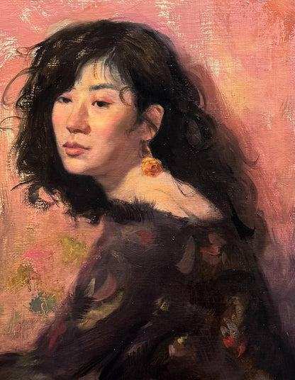 Oil painting portrait of woman with dark wavy hair and orange floral earring by Shirley Annam Butt