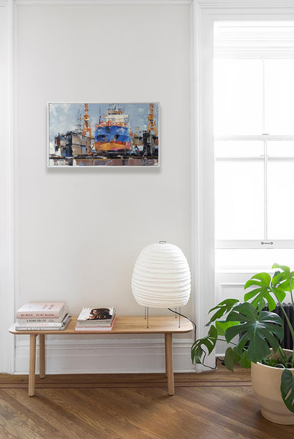 White ribbed paper lantern lamp by Volodymyr Gluhomanyuk on wooden bench
