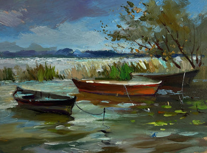 Oil painting by Yuriy Suprunchuk: rustic rowboat moored near reeds