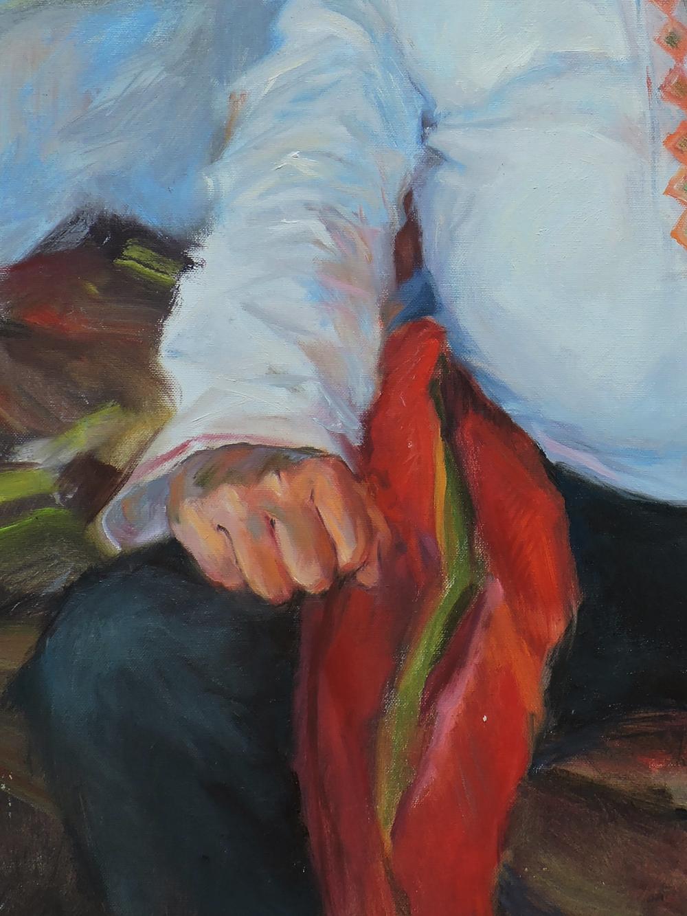 Hand holding red green-striped fabric in Cossack portrait by Oksana Osnach