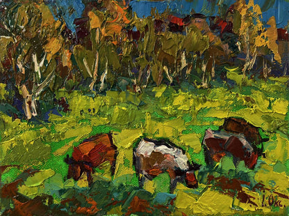 Vibrant impressionist oil painting by Oksana Ivanyuk of cows grazing in lush meadow