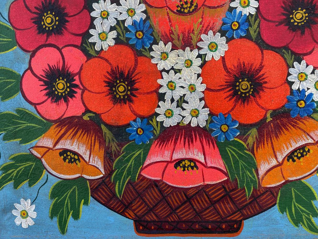 Oil painting of vibrant red poppies in woven brown basket