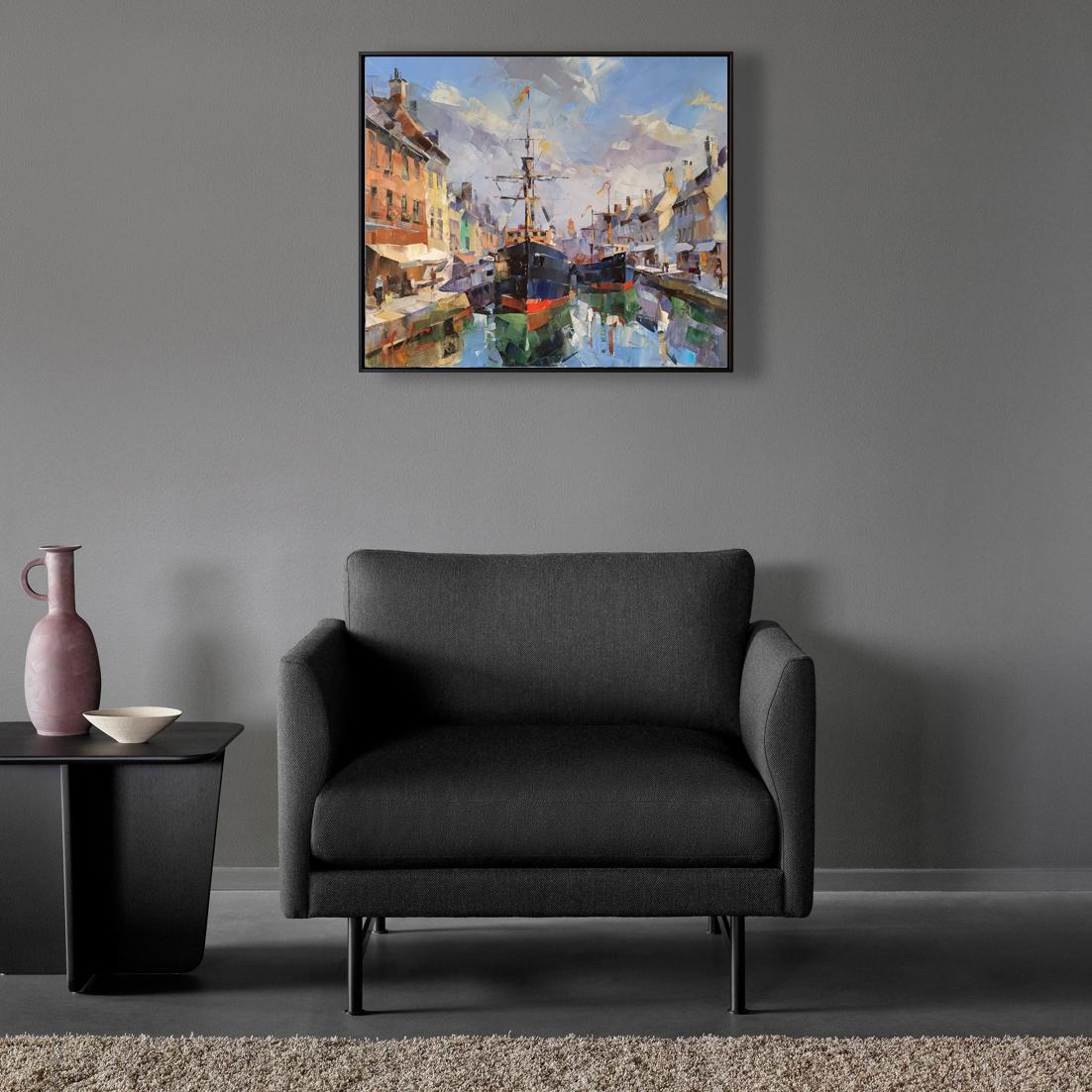 Black upholstered armchair with sleek metal legs for Oil painting Fantasies of the Port of Gandia by Volodymyr Gluhomanyuk