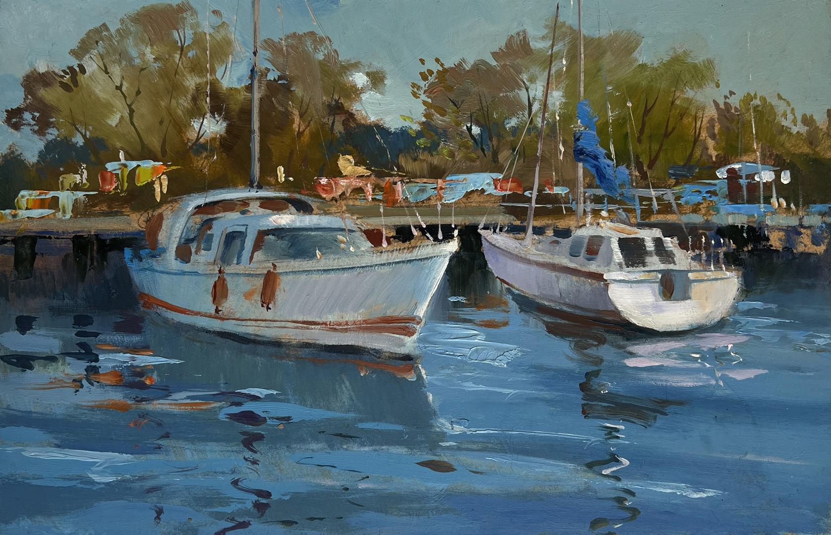 Oil painting of two white sailboats moored in calm blue water by Yuriy Suprunchuk