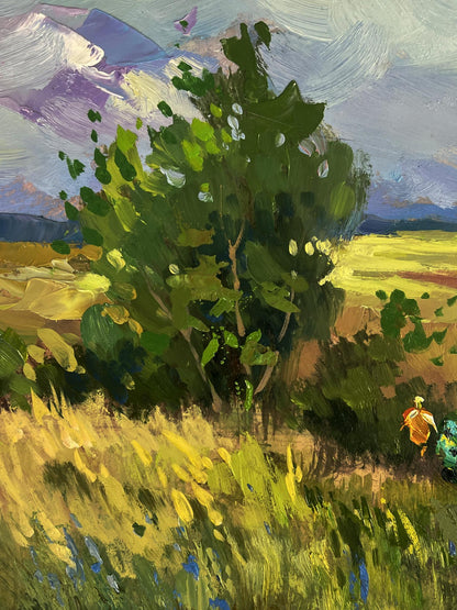 Oil painting by Yuriy Suprunchuk: vibrant green tree in sunlit golden field