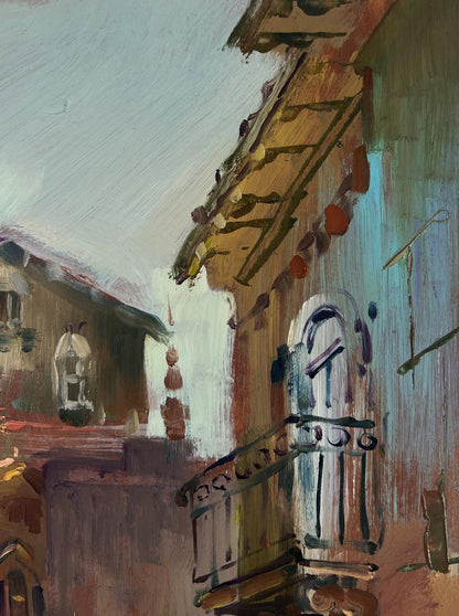 Oil painting of narrow city streets by Yuriy Suprunchuk with rustic building