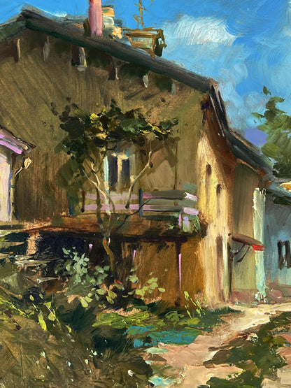 Oil painting of rustic house on city street by Yuriy Suprunchuk