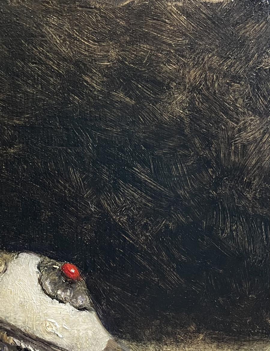 Glossy red bead on oil painting of ornate Annam flute shell
