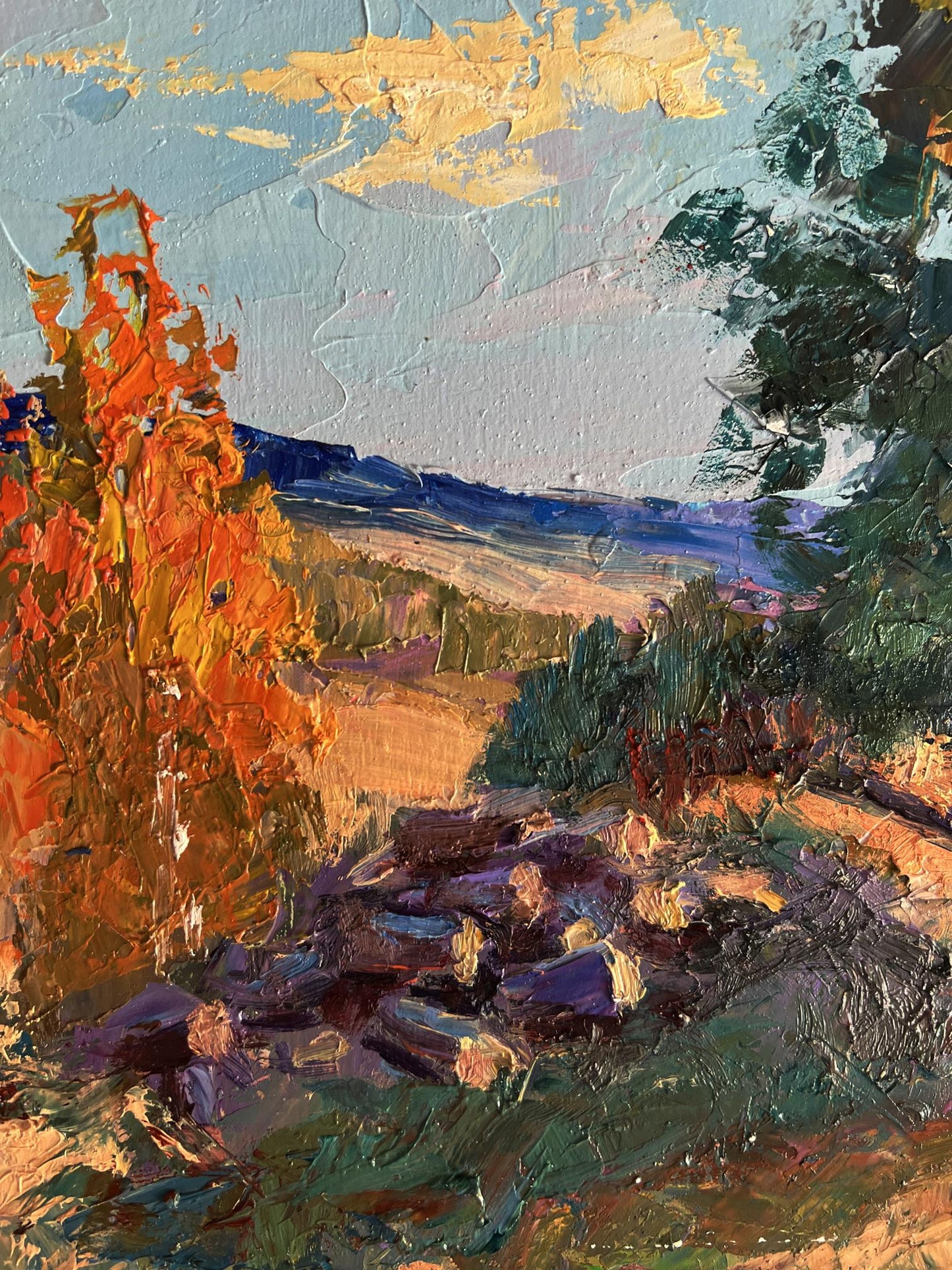 Oil painting of house on hill by Boris Serdyuk with orange foliage and blue sky