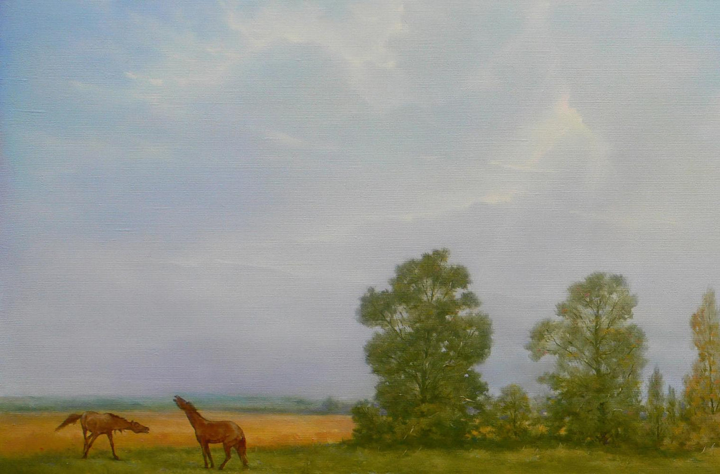 Serene oil painting by Vasily Korkishko: horses grazing in golden field under cloudy sky