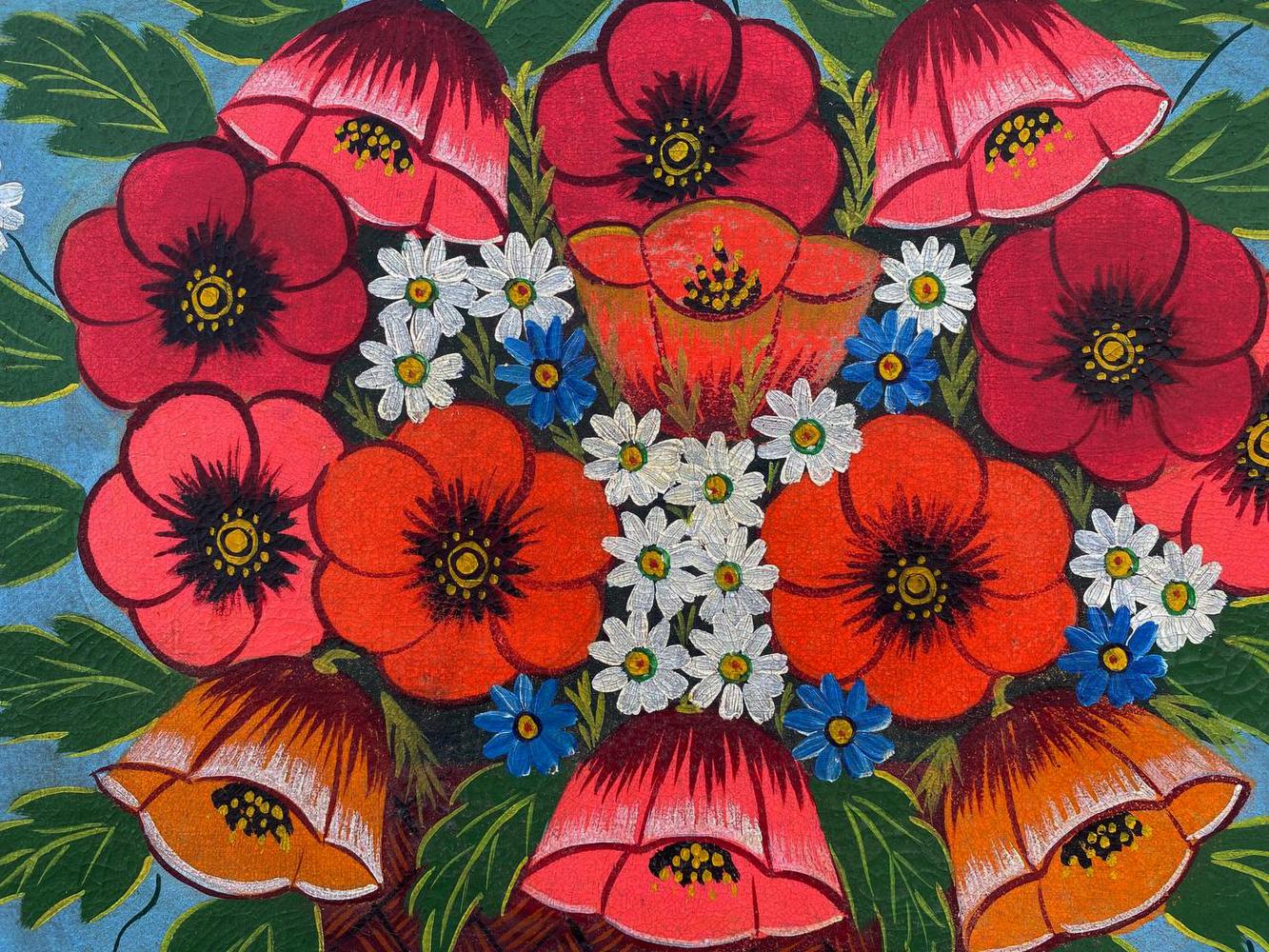 Oil painting of red poppies in a basket with daisies