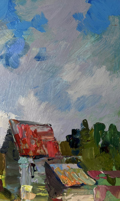 Oil painting of fishermen resting near shore by Yuriy Suprunchuk on red white striped bench