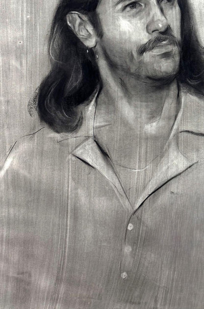 Charcoal portrait sketch of Alessio Annam Butt, long hair, mustache