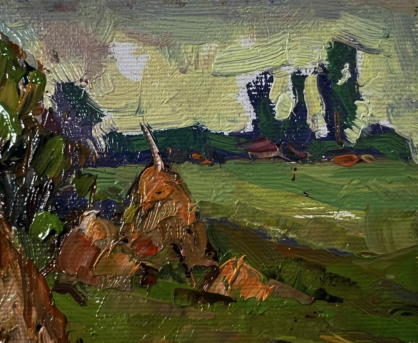 Impasto oil painting of haystacks in field by Oksana Ivanyuk