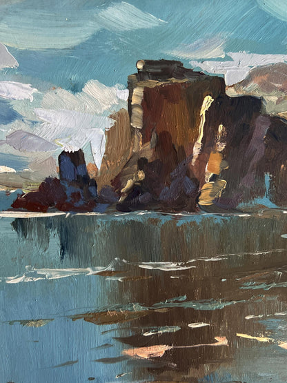Oil painting of rugged cliffs by the coast near mountains by Yuriy Suprunchuk