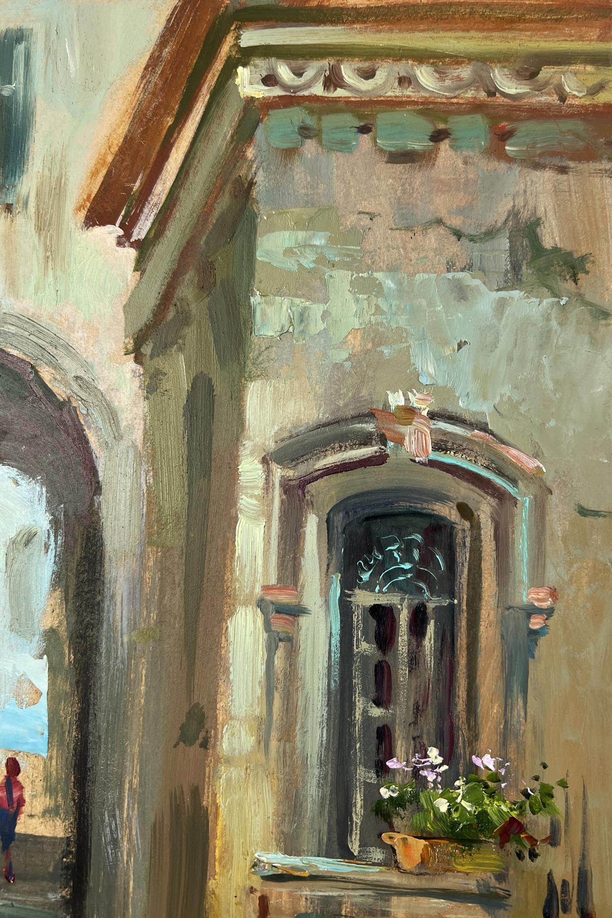 Weathered stone archway with dark ornate window and potted plant by Yuriy Suprunchuk