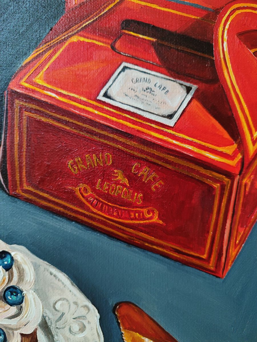 Oil painting Desert on the table Oksana Sklym with vibrant red gold-trimmed Grand Café Leopold takeout box