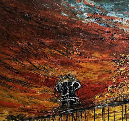 A black and white water tower stands prominently against a vibrant, textured sky painted in fiery reds, oranges, and deep browns.