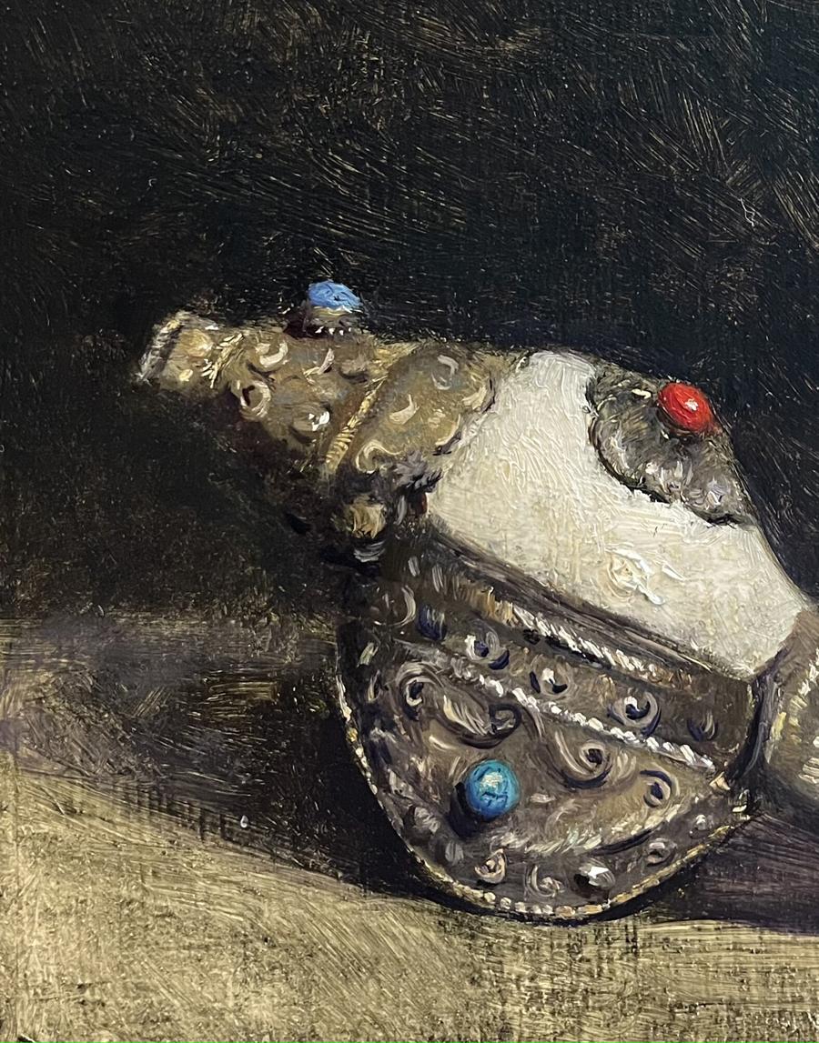 Silver ornate belt buckle with blue red gems in Annam Butt painting