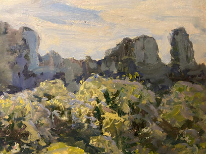 Oil painting Morning by Georgy Kolosovsky: rugged rocks and yellow-green foliage