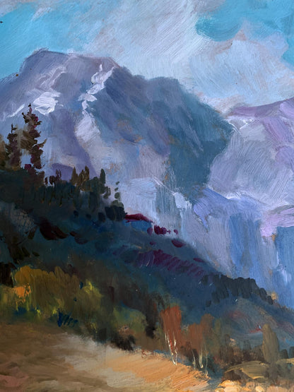 Oil painting of road leading to textured blue-purple mountains by Yuriy Suprunchuk