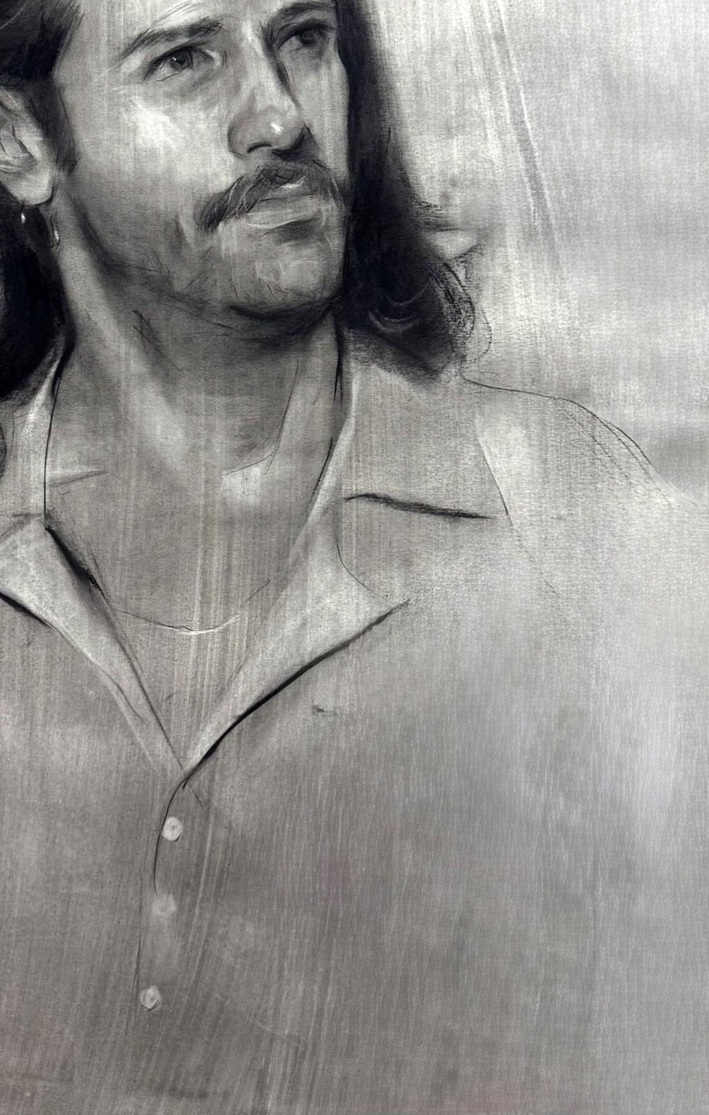 Charcoal portrait sketch of Alessio Annam Butt, long hair, mustache
