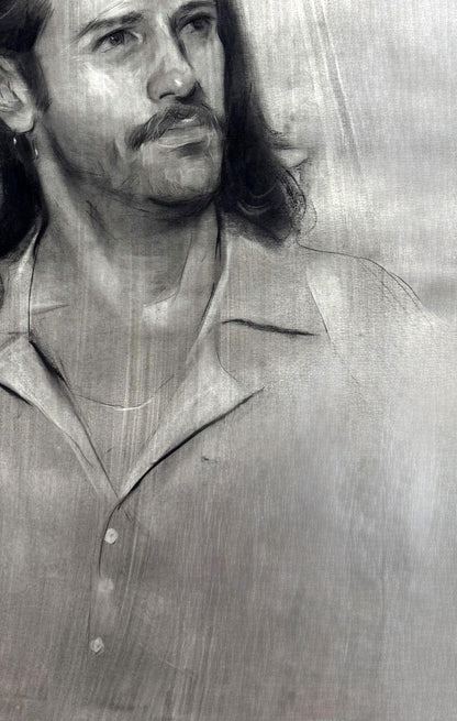 Charcoal portrait sketch of Alessio Annam Butt, long hair, mustache