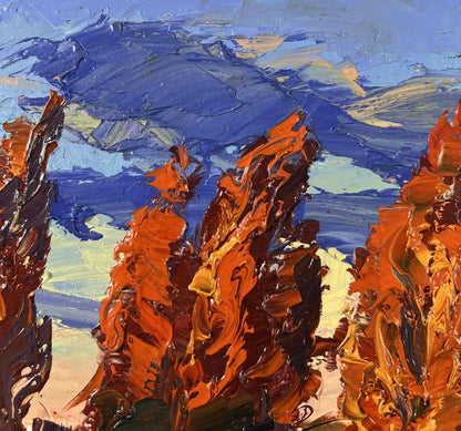 Oil painting Autumn poplars by Boris Serdyuk: vibrant orange red rocks blue sky