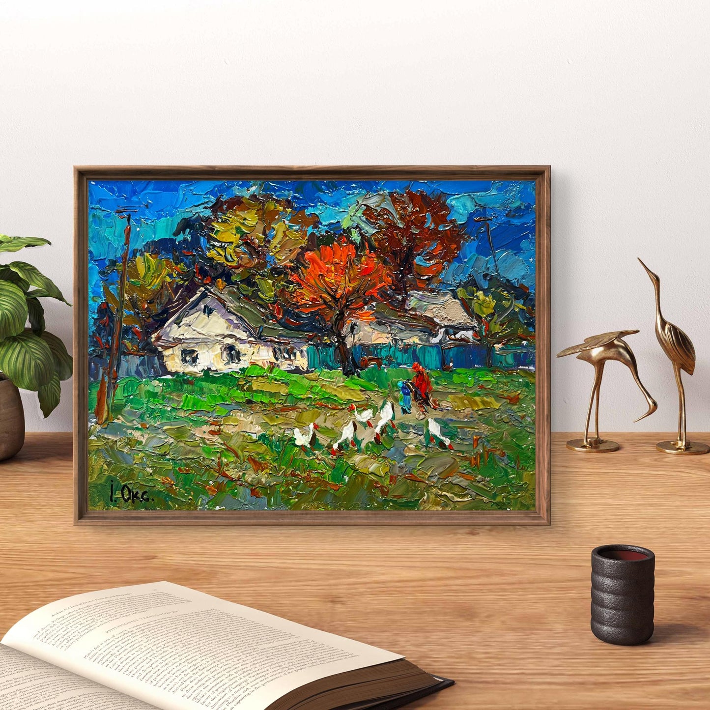 Vibrant oil painting of village street by Oksana Ivanyuk in rustic frame