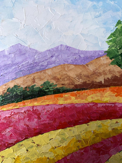 Vibrant oil painting of pink yellow flower fields and purple mountains by V. Zadorozhnya