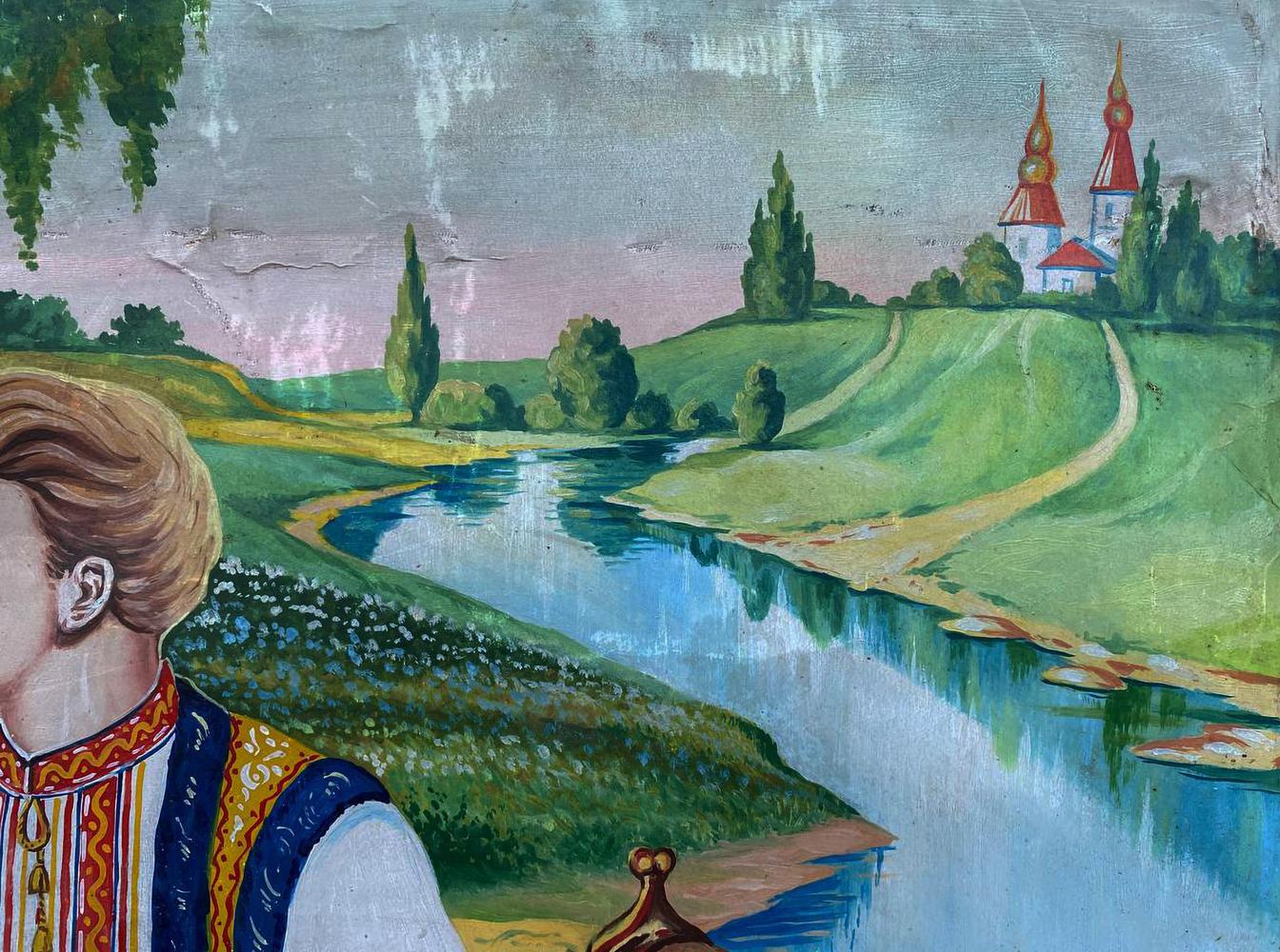 Oil painting of man picking flowers by river with church spires