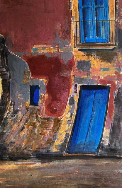 Vibrant blue door on paint-splattered wall in Before the Fight by Juan Angel Gonzalez de la Calle