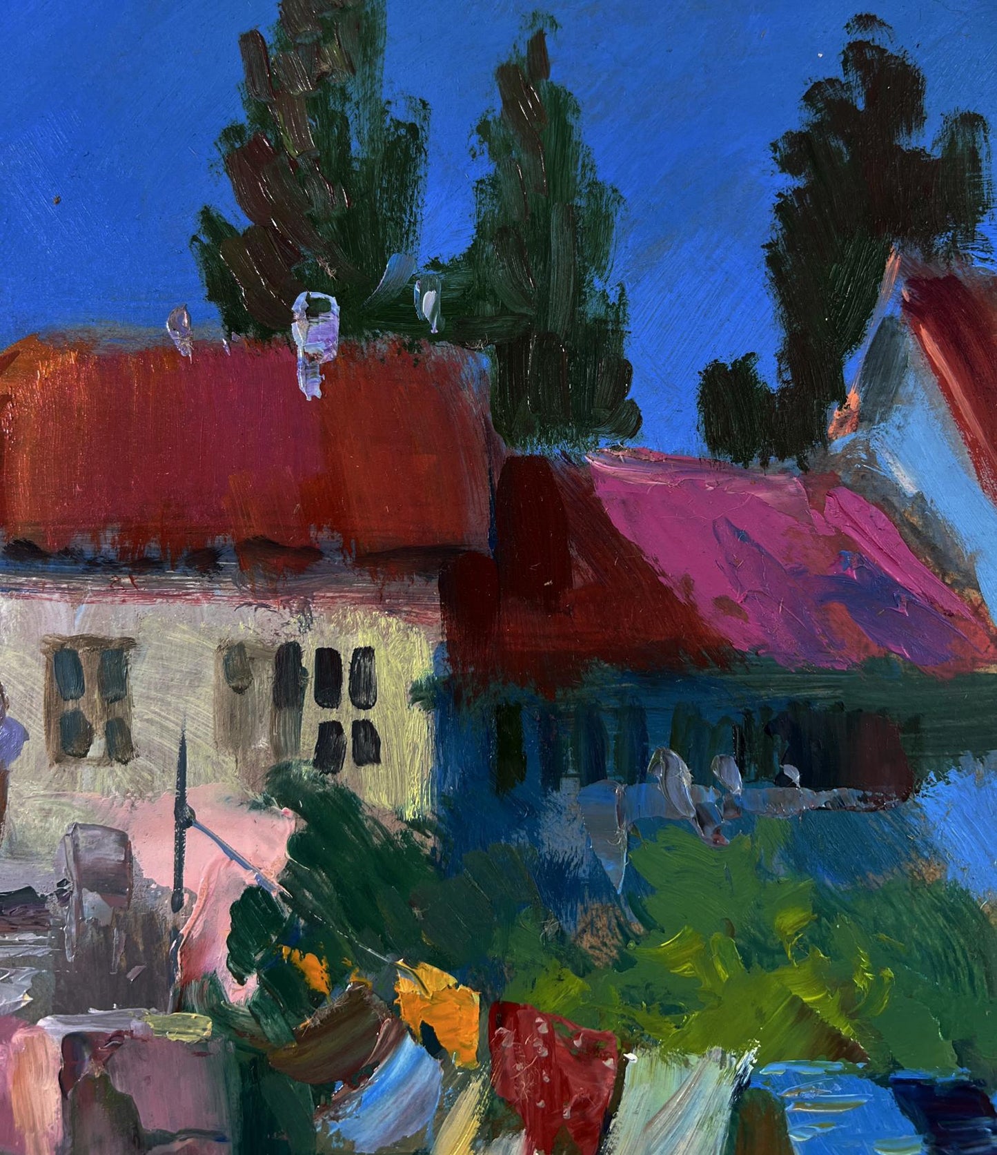 Vibrant impressionist oil painting by Yuriy Suprunchuk of houses with red pink roofs