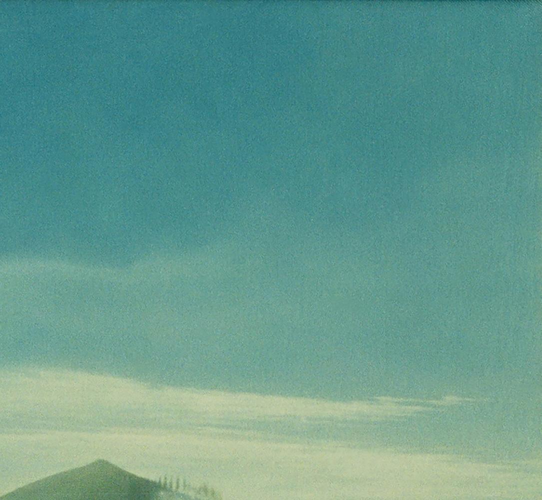 Oil painting by Vasily Korkishko: teal sky, wispy clouds over green hill