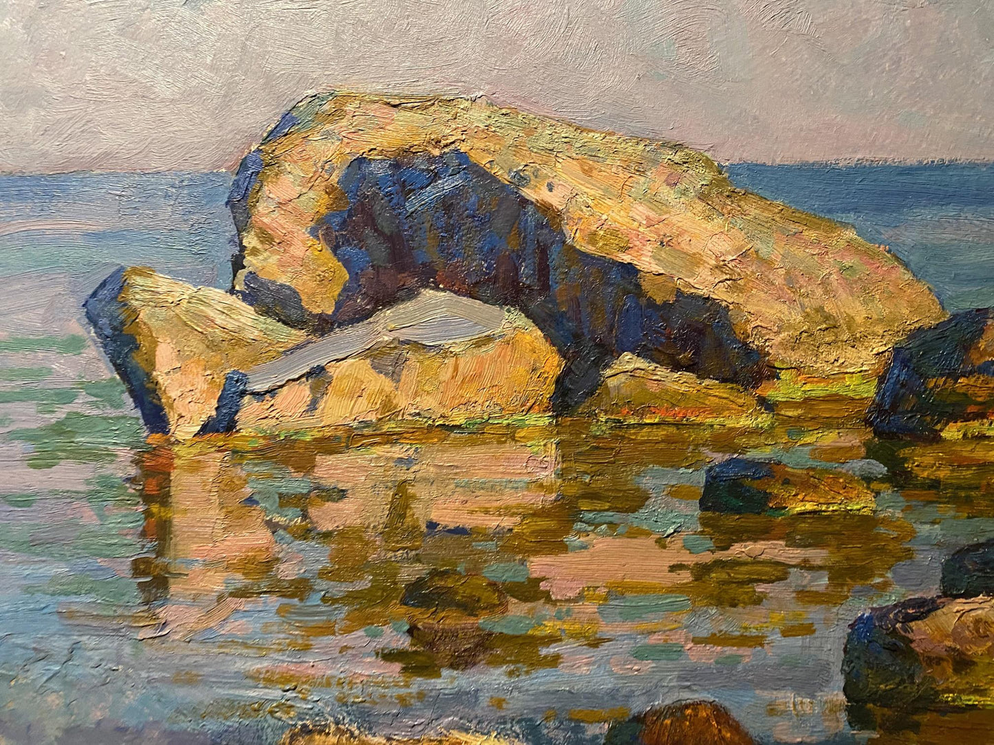 Oil painting of rocks near seashore by Grigoriy Ruban