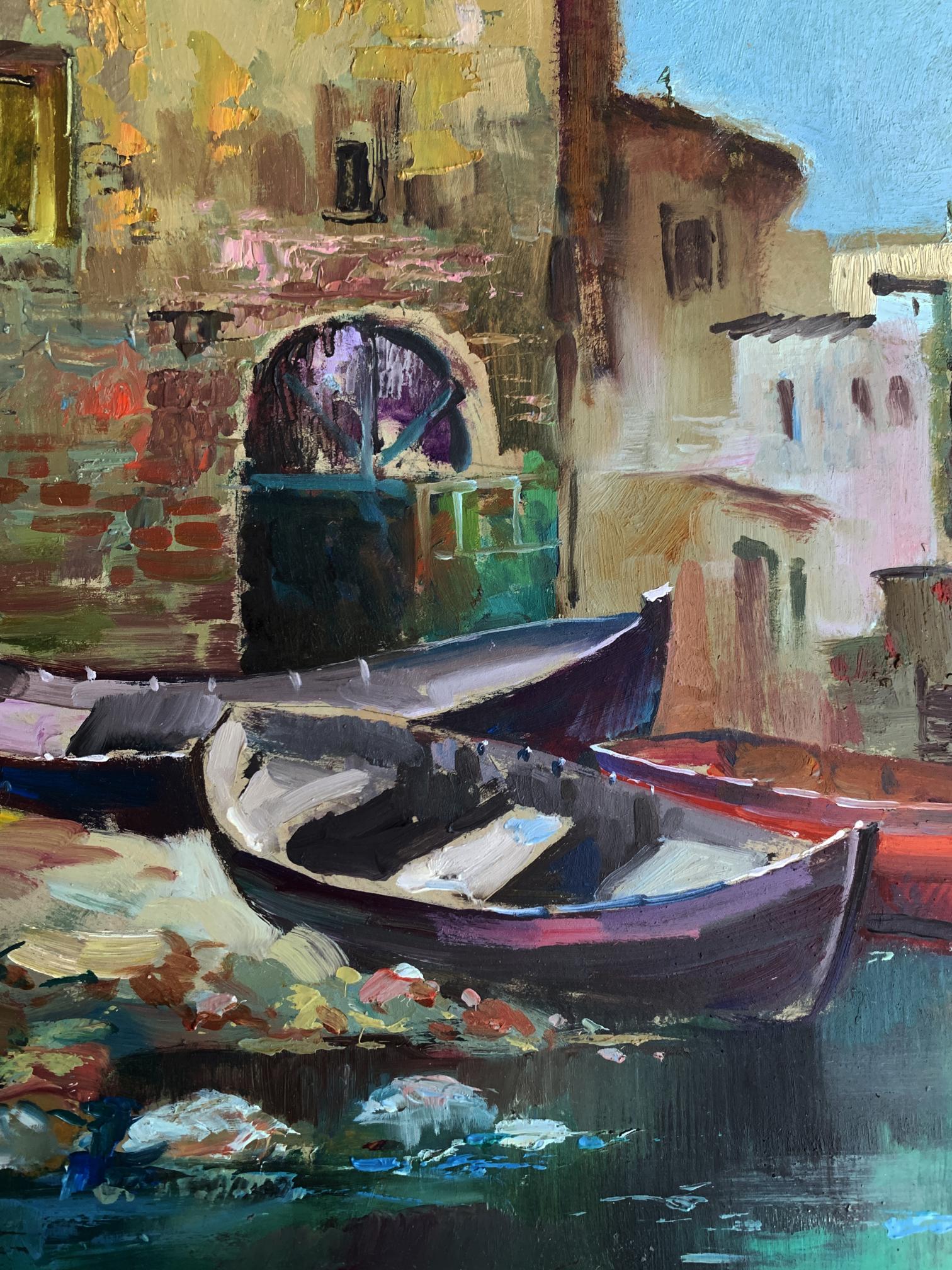 Oil painting by Yuriy Suprunchuk of sunlit canal with boats