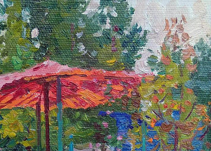 Oil painting Gazebo by Yury Konovalov: vibrant red orange umbrella in lush green garden