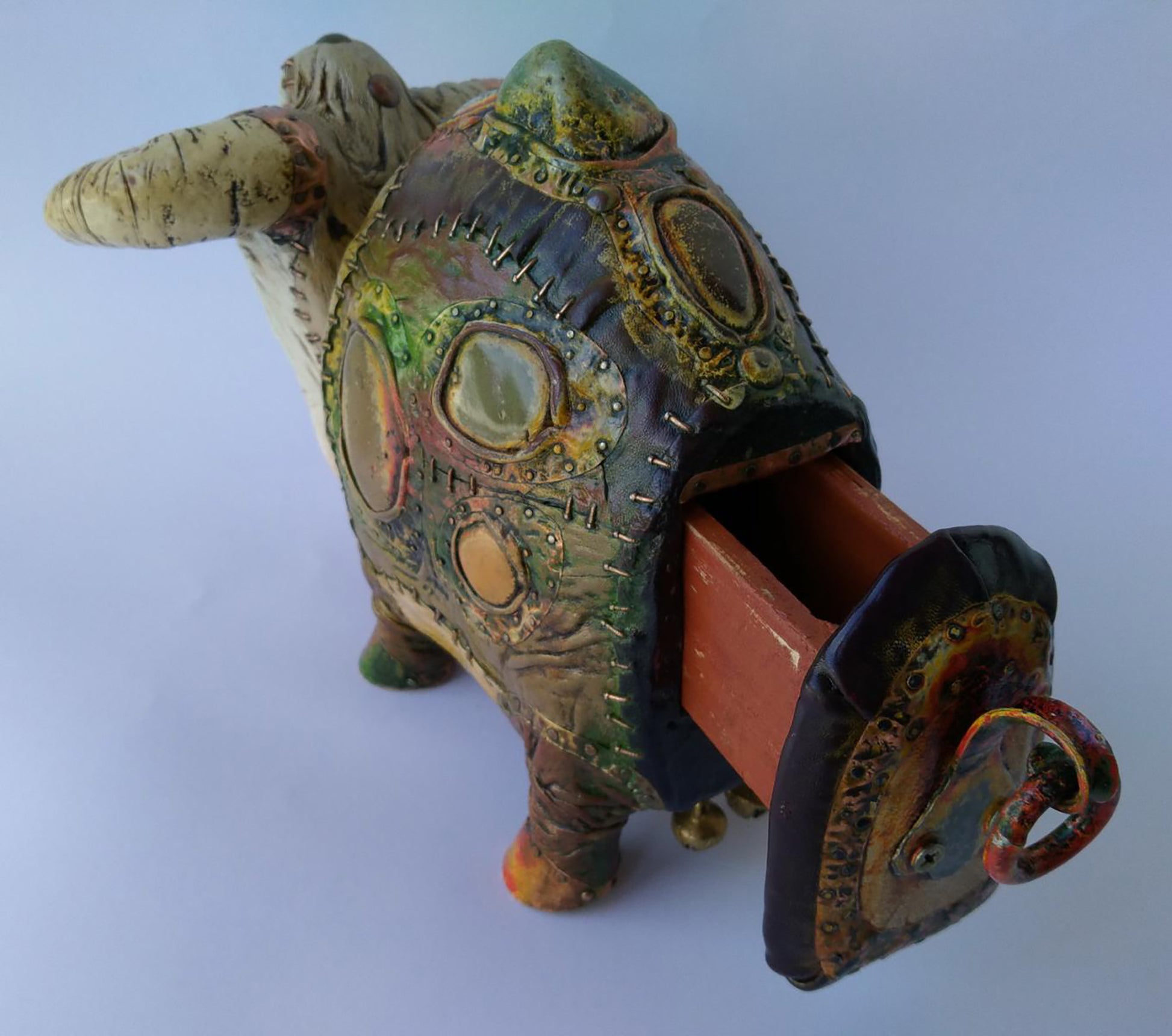 Back view of Dmytro Kravtsov steampunk piggy bank with patina and rivets
