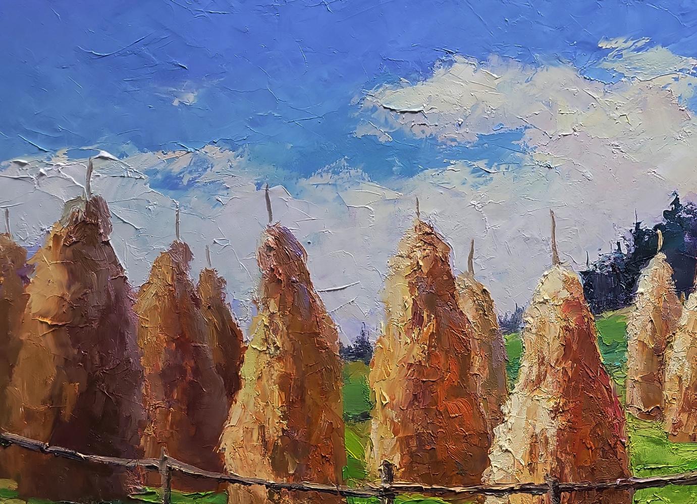 Oil painting Haystacks in the mountains by Boris Serdyuk, golden hay bales under blue sky