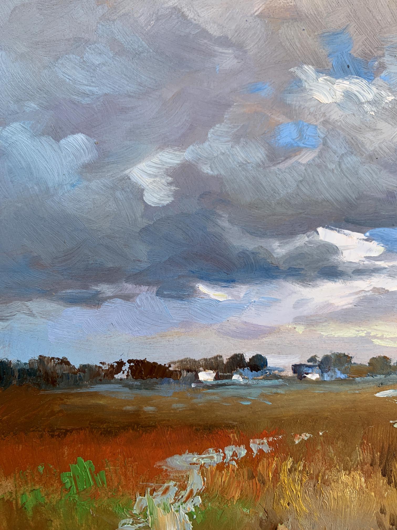 Oil painting Not far from the village by Yuriy Suprunchuk: dramatic sky over golden field