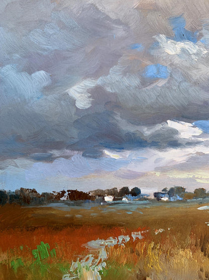 Oil painting Not far from the village by Yuriy Suprunchuk: dramatic sky over golden field